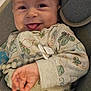 Malakai is registered to the contest to win money with this photo: baby, car_seat, child, closeup, comfort, cute, face, hand, happy, indoors, infant, onesie, patterned_clothing, person, playful, seatbelt, smile, straps, tongue_out, young_child