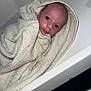 baby, newborn, towel, wrapped, infant, face, eyes, expression, portrait, bathtime, tub, soft_texture, blanket, skin, close_up, gaze, cute, laying, washcloth, nursery