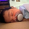 Levaeh is registered to the contest to win money with this photo: baby, sleeping, pacifier, blanket, infant, face, child, resting, indoors, furniture, dresser, head, cozy, soft, peaceful, person, portrait, skin, clothing, home