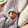newborn, baby, sleeping, hoodie, infant, cozy, pink, plush, seat, window, indoor, child, cute, peaceful, soft, warm, clothing, resting, portrait, babywear