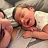 Levaeh is registered to the contest to win money with this photo: baby, smile, infant, adult, face, close_up, couch, resting, love, joy, comfort, skin, hair, hand, clothing, indoor, person, portrait, tender, family