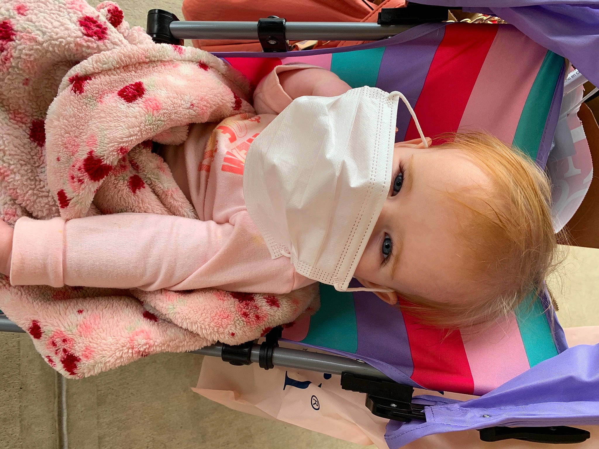 Addison is registered to the contest to win money with this photo: baby, baby_carriage, baby_products, baby_toddler_clothing, carmine, child, comfort, fashion_accessory, headgear, leisure, linens, magenta, mouth, person, pink, red, room, skin, toddler, white