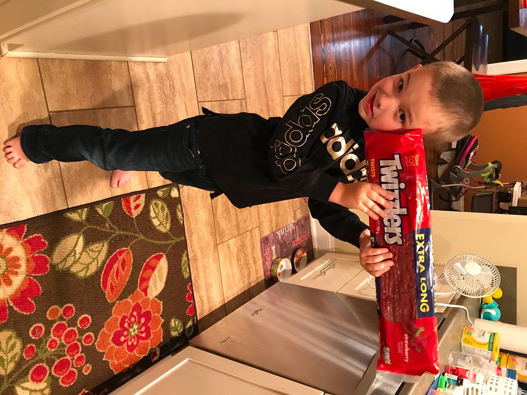 Coleman is registered to the contest to win money with this photo: beer, child, event, flooring, flower, fun, games, leisure, pattern, person, play, recreation, room, shelf, t_shirt, toddler, wood