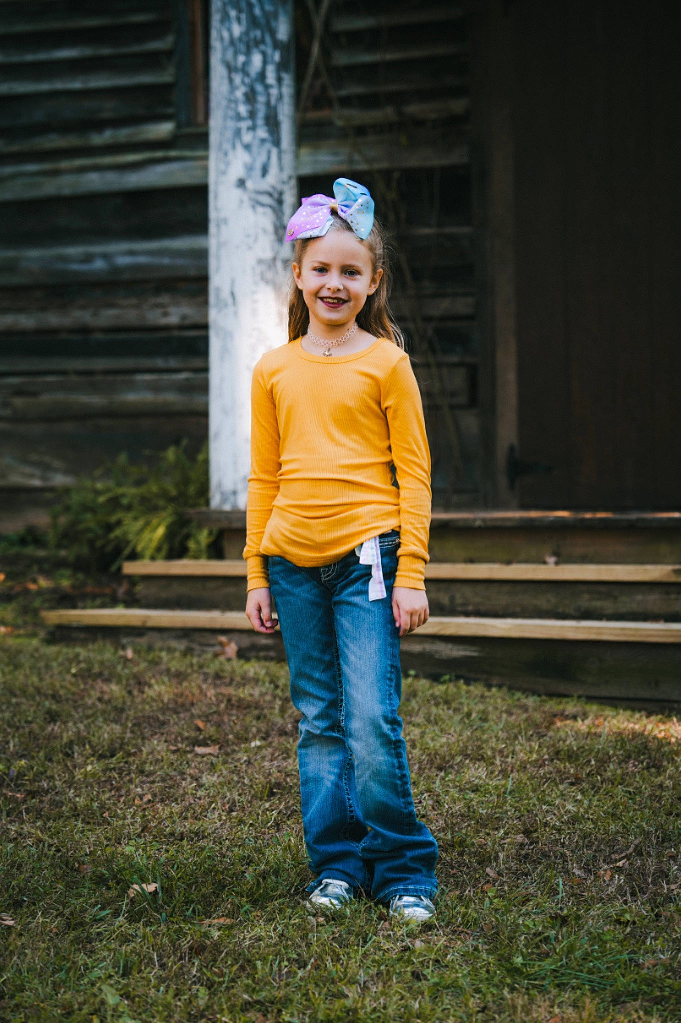 Lyla is registered to the contest to win money with this photo: clothing, denim, electric_blue, flash_photography, fun, grass, grassland, happy, headgear, jeans, joy, leisure, outerwear, people_in_nature, person, plant, recreation, smile, street_fashion, t_shirt