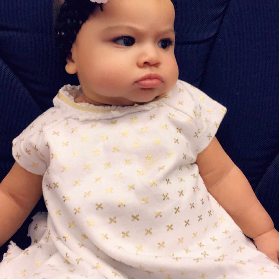Erynn joined the competition — help win amazing prizes! baby, baby_products, baby_toddler_clothing, cheek, child, child_model, clothing, dress, fashion_accessory, hair_accessory, headband, headgear, headpiece, pattern, person, skin, sleeve, smile, toddler, white