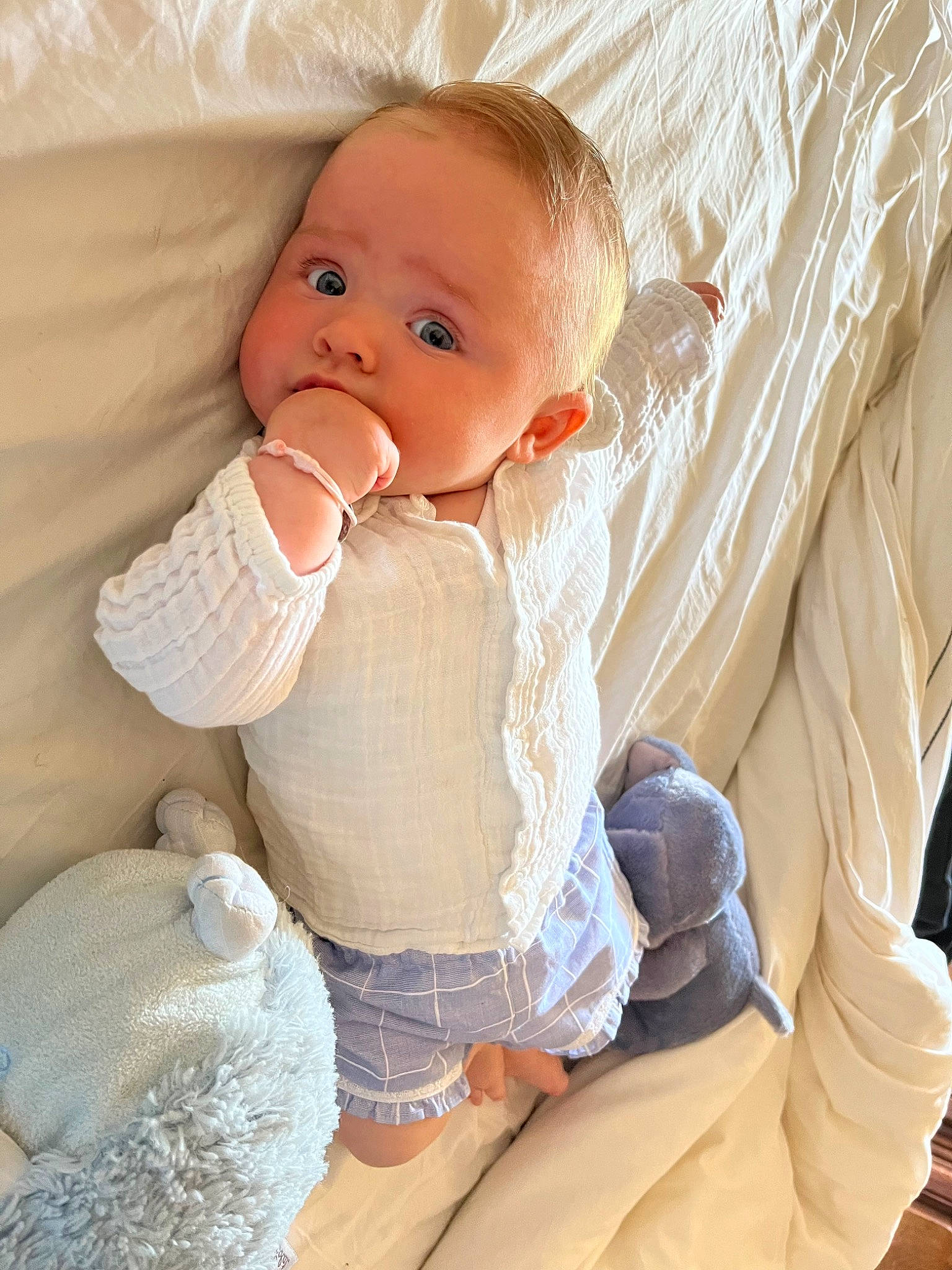 Tess participe au concours pour gagner de l'argent avec cette photo : arm, baby, baby_products, baby_sleeping, baby_toddler_clothing, cheek, child, comfort, finger, happy, human_leg, knee, linens, person, sitting, skin, sleeve, stomach, thigh, thumb