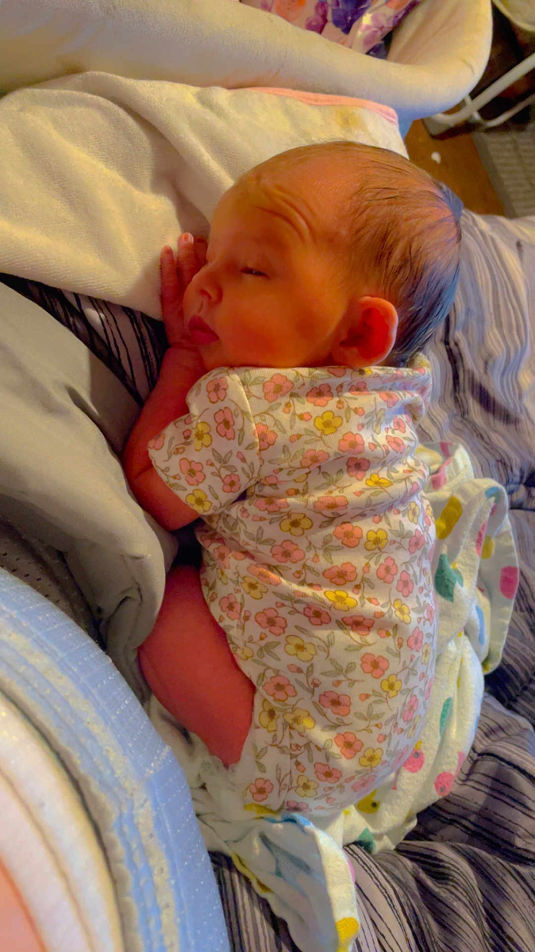 Faith is registered to the contest to win money with this photo: baby, sleeping, infant, floral_onesie, blanket, bed, cozy, newborn, peaceful, face, hand, skin, soft, resting, cute, indoors, comfort, child, person, toddler