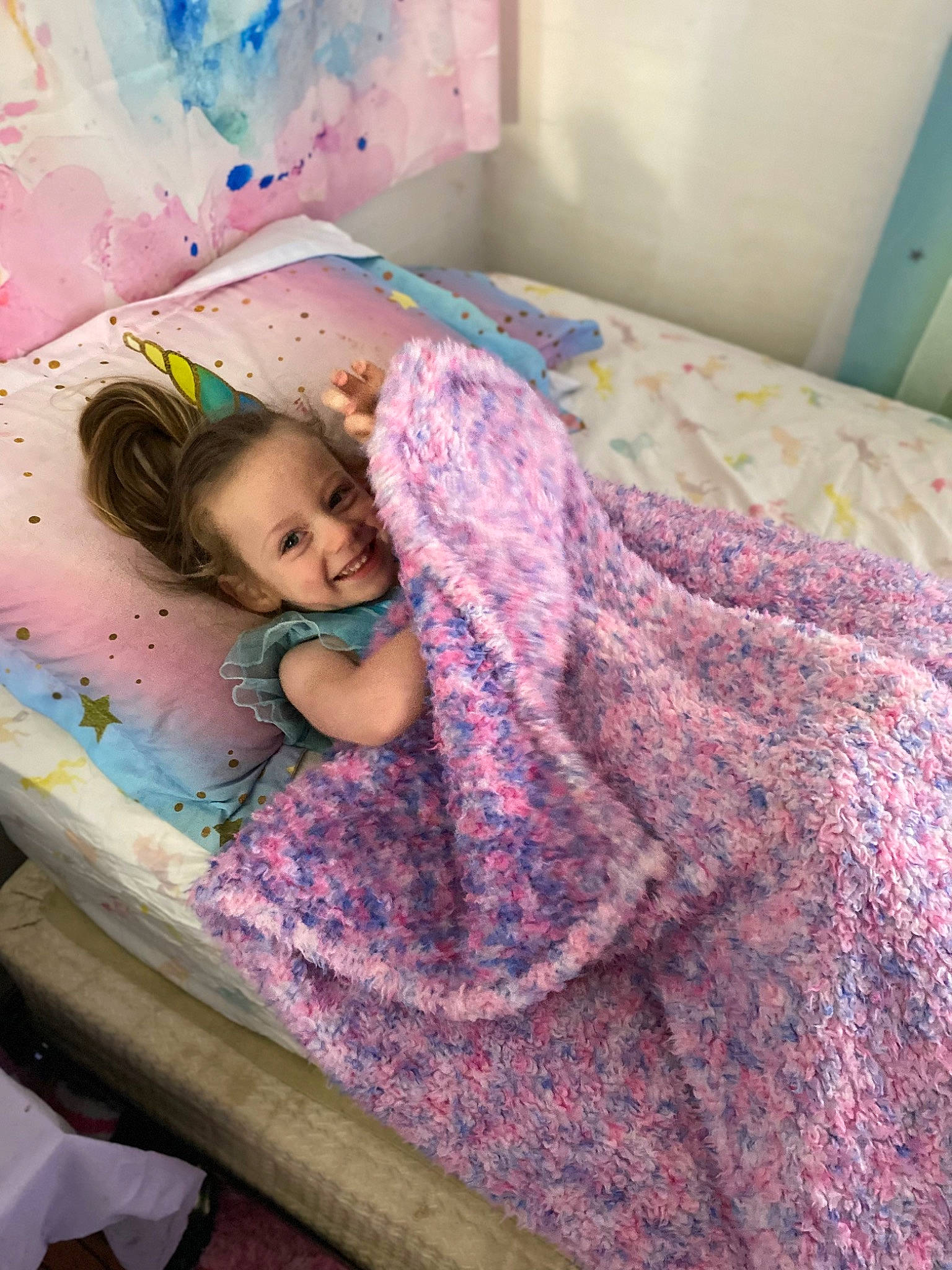 Kora is registered to the contest to win money with this photo: baby, bed, bed_frame, bed_sheet, bedding, bedroom, child, comfort, floor, flooring, happy, joy, linens, magenta, pattern, person, pink, purple, room, skin