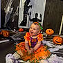 Dolcie-Rae joined the competition — help win amazing prizes! baby, child, costume, cute, decorations, festive, floor, halloween, happy, headband, holiday, indoor, jack_o_lantern, orange, portrait, pumpkin, purple, smile, spooky, web