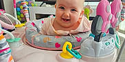 Dolcie-Rae joined the competition — help win amazing prizes! baby, baby_activity_center, child, colorful, cute, early_childhood, expression, face, floor, fun, happy, home, indoor, infant, person, pink, play, seat, smiling, toys