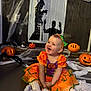 Dolcie-Rae is registered to the contest to win money with this photo: baby, celebration, child, costume, cute, decoration, festive, halloween, happy, headband, holiday, indoor, jackolantern, orange, person, pumpkin, purple, shadow, smile, spiderweb