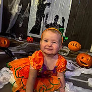 Dolcie-Rae joined the competition — help win amazing prizes! baby, carved_pumpkins, celebration, child, costume, crawling, cute, decorations, festive, fun, green_bow, halloween, holiday, indoor, orange, party, pumpkin_costume, shadow_puppets, smiling, spider_web