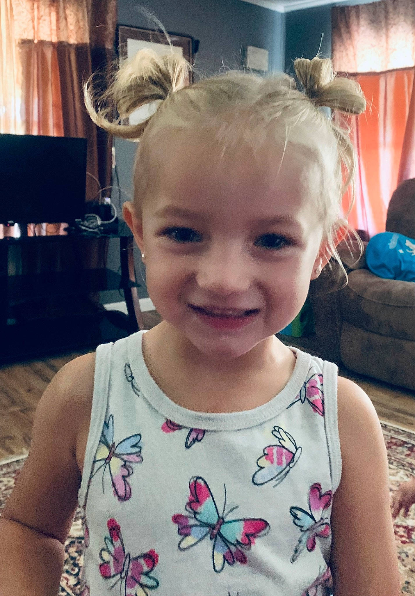 Kynlee is registered to the contest to win money with this photo: baby_toddler_clothing, cheek, chin, cool, eye, eyelash, face, happy, head, iris, joy, neck, person, shoulder, skin, sleeve, smile, standing, summer, t_shirt