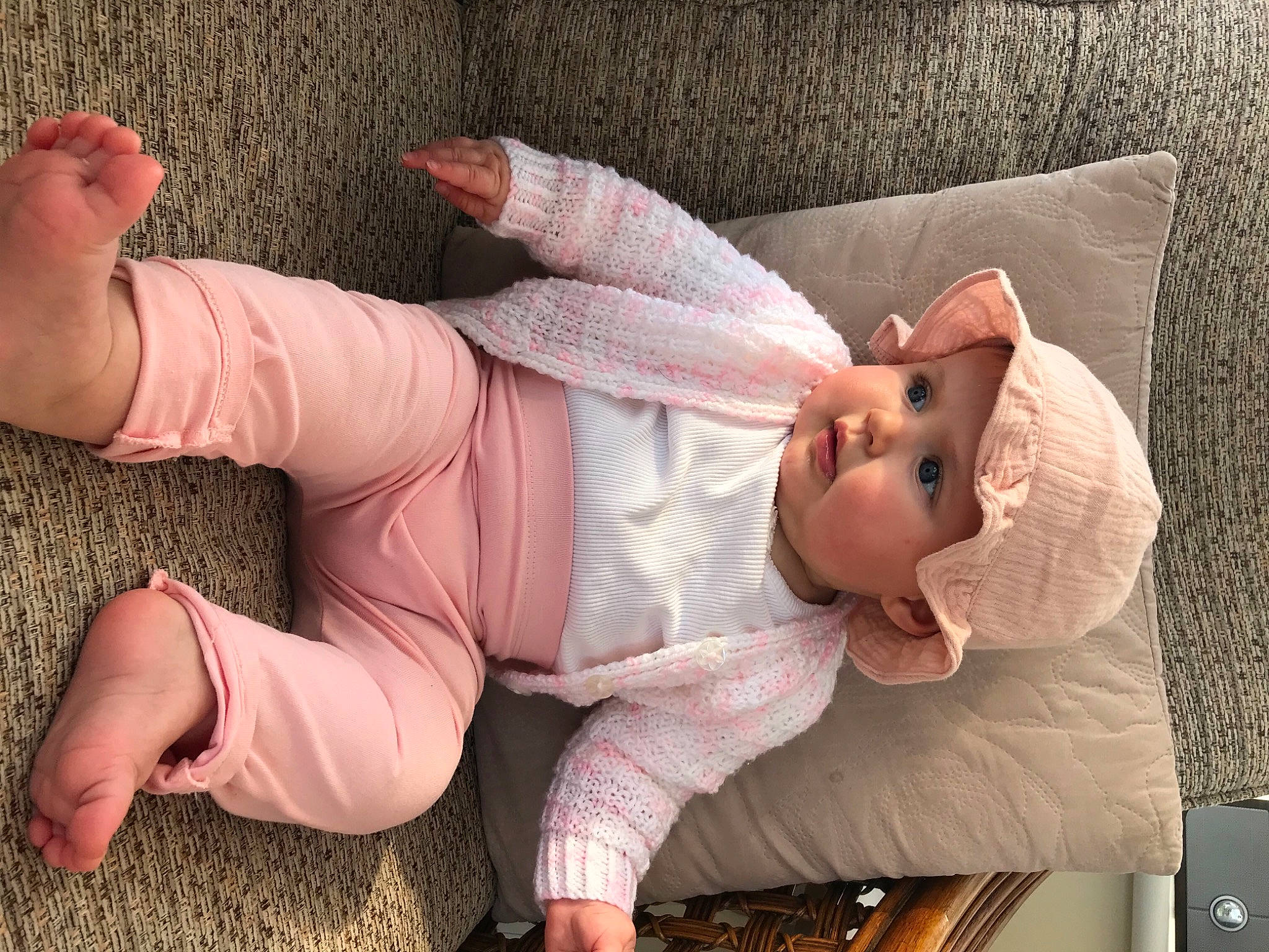 Bleù is registered to the contest to win money with this photo: arm, baby, baby_toddler_clothing, child, comfort, finger, flesh, foot, gesture, headwear, human_body, human_leg, joint, knee, leg, nail, person, pink, skin, textile