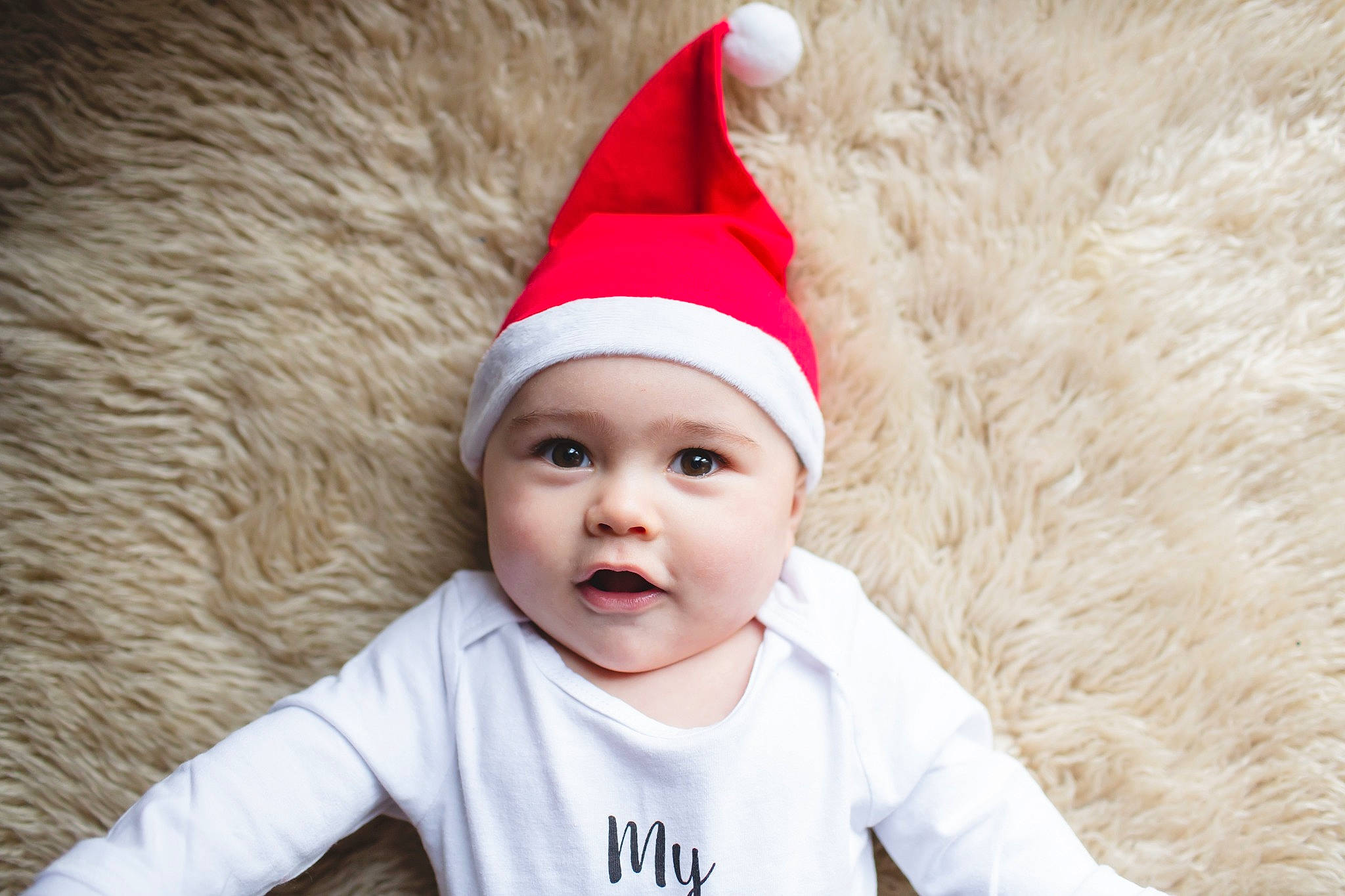 Beckham joined the competition — help win amazing prizes! baby, beanie, child, christmas, christmas_eve, costume_accessory, costume_hat, fictional_character, happy, headgear, headwear, holiday, party_hat, person, santa_claus, toddler