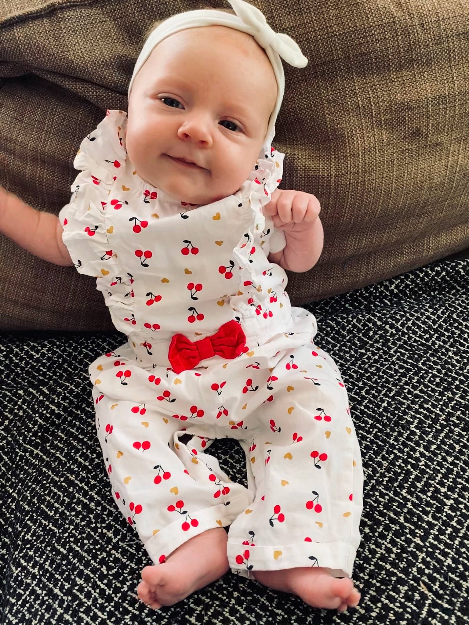 Jade participe au concours pour gagner de l'argent avec cette photo : arm, baby, baby_toddler_clothing, child, collar, comfort, face, happy, linens, pattern, person, pink, product, sitting, skin, sleeve, smile, t_shirt, textile, thigh