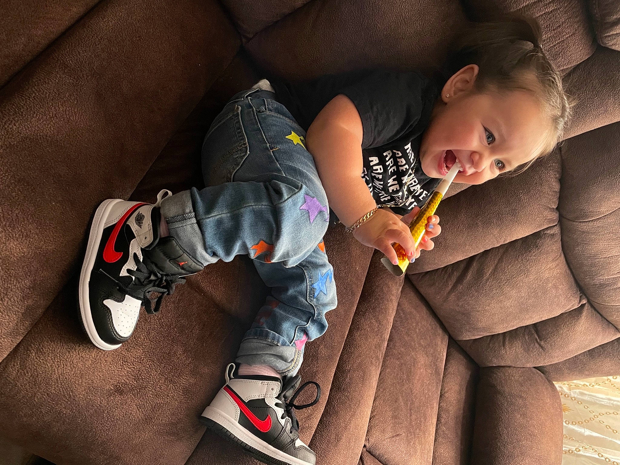 Allyson joined the competition — help win amazing prizes! arm, baby, comfort, finger, flash_photography, floor, flooring, hand, happy, human_body, joint, knee, lap, leg, mammal, mouth, person, shoe, skin, sneakers