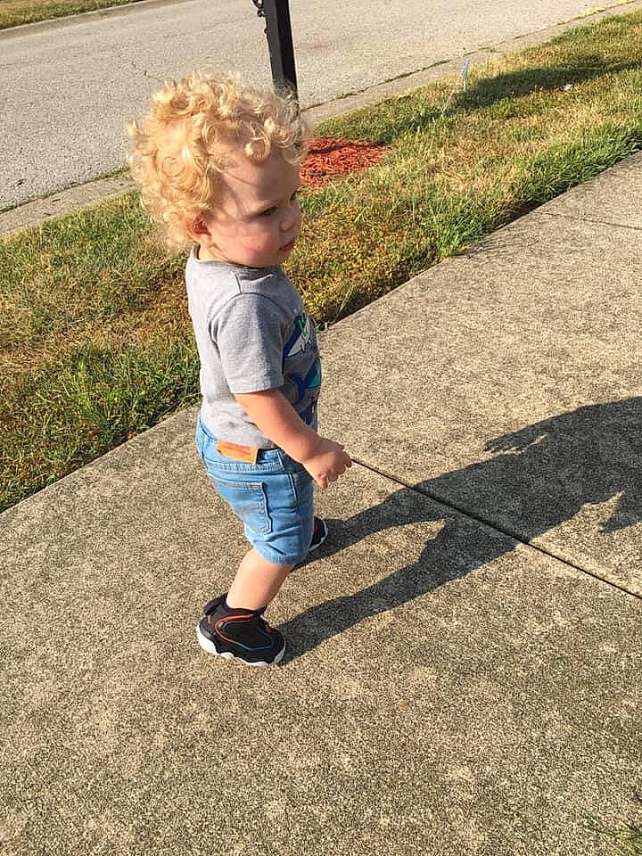 Carlos joined the competition — help win amazing prizes! asphalt, child, denim, electric_blue, flooring, grass, grass_family, human_body, human_leg, lawn, leisure, people_in_nature, person, plant, recreation, road, road_surface, sidewalk, t_shirt, toddler