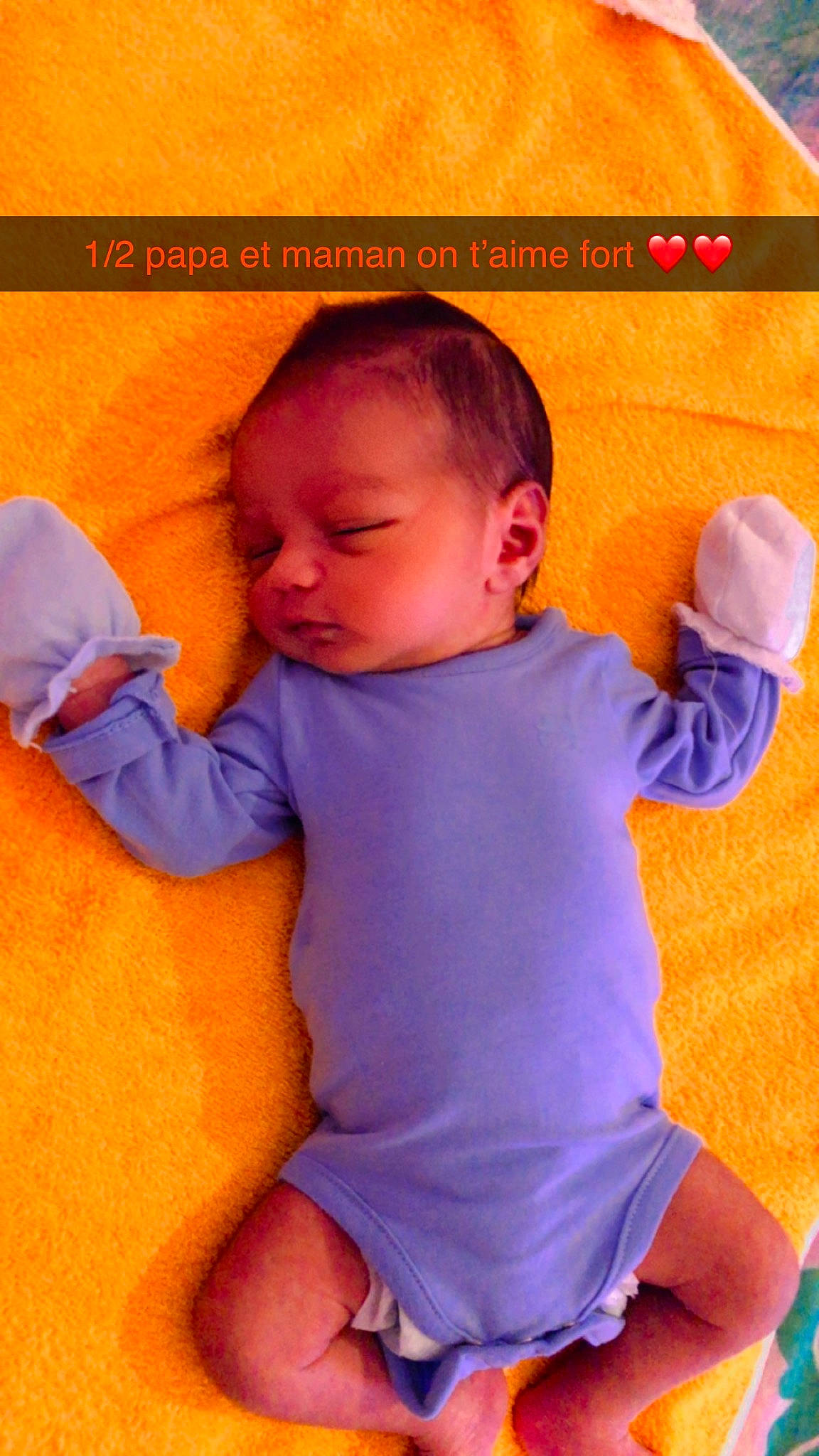 Lucienzo participe au concours pour gagner de l'argent avec cette photo : arm, baby, baby_toddler_clothing, cheek, child, comfort, facial_expression, finger, gesture, happy, human, nose, orange, organ, person, pink, product, skin, sleeve, thumb