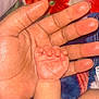 baby_hand, adult_hand, skin, close_up, fingers, hand, protection, care, newborn, infant, touch, love, family, blanket, pattern, colorful, soft, warm, skin_tone, background