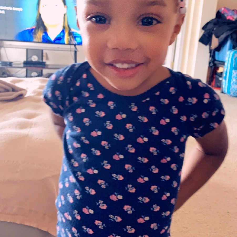 Zamyiah joined the competition — help win amazing prizes! baby, baby_toddler_clothing, blue, cheek, child, clothing, design, face, head, joy, leotard, pattern, person, skin, sleeve, smile, sportswear, t_shirt, toddler