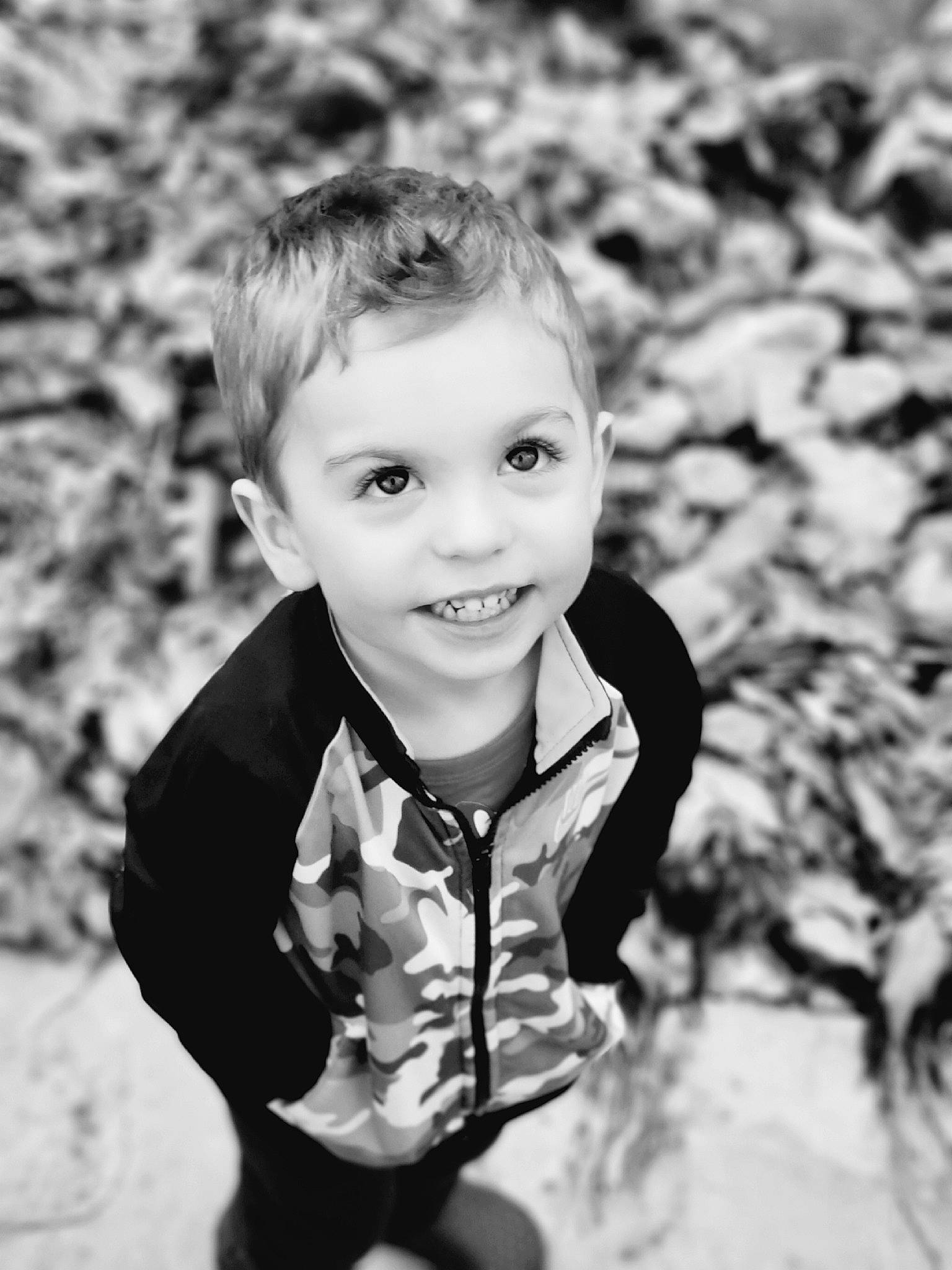 Oliver joined the competition — help win amazing prizes! black_and_white, blond, child, eye, flash_photography, fun, grass, happy, joy, laugh, monochrome, monochrome_photography, people_in_nature, person, plant, sitting, smile, standing, style, toddler