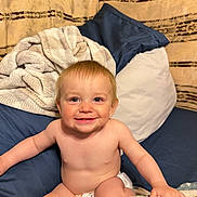 Beau joined the competition — help win amazing prizes! baby, toddler, smiling, diaper, blanket, pillow, bed, indoor, child, happy, cute, skin, face, hair, blue_eyes, sitting, comfort, cozy, infant, young_child