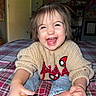 Airika joined the competition — help win amazing prizes! toddler, child, smile, happy, sweater, spiderman, plaid, bedspread, indoor, hair, face, cheerful, jeans, foot, hands, room, poster, furniture, cozy, playful