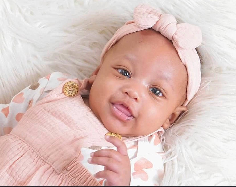 Aubreigh joined the competition — help win amazing prizes! baby, baby_toddler_clothing, cheek, child, comfort, eye, eyebrow, eyelash, flash_photography, gesture, happy, headgear, iris, linens, lip, person, pink, sleeve, smile, toddler