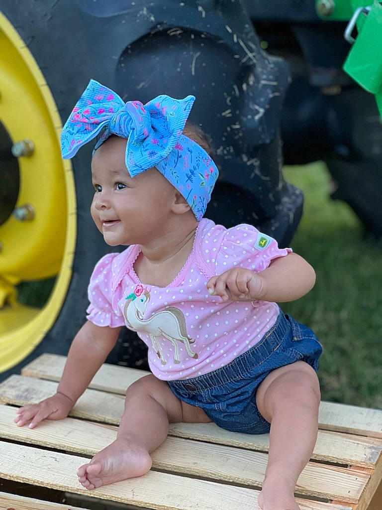 Diamond joined the competition — help win amazing prizes! baby, baby_toddler_clothing, cap, child, facial_expression, fun, grass, green, happy, hat, headwear, human_leg, leisure, magenta, person, pink, purple, recreation, thigh, toddler