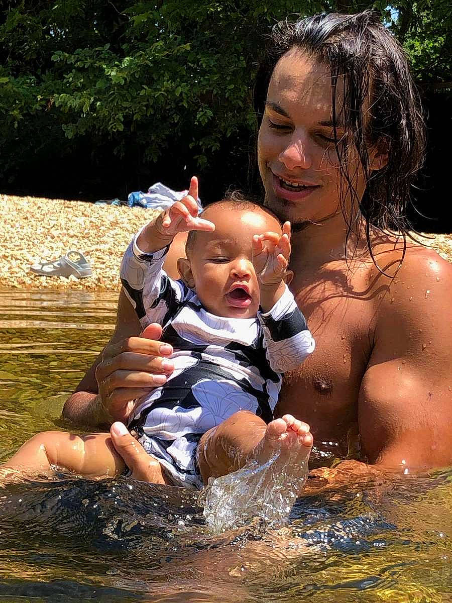 Diamond is registered to the contest to win money with this photo: barechested, bathing, chest, child, event, face, fun, grass, happy, head, human_body, joy, leisure, people_in_nature, person, recreation, smile, stream, toddler, tree