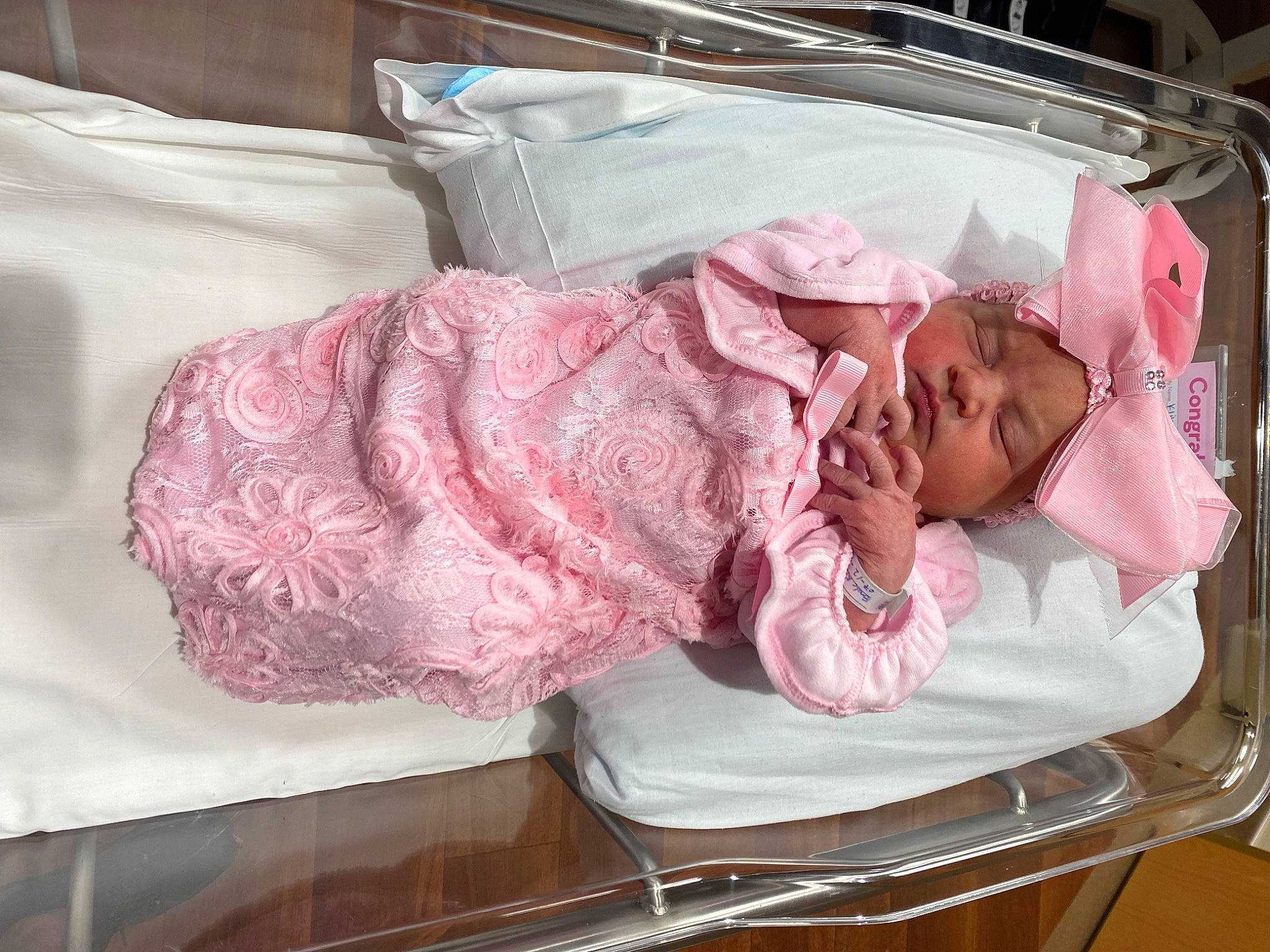 Gracelynn is registered to the contest to win money with this photo: baby, baby_products, baby_safety, baby_toddler_clothing, bedding, child, comfort, flesh, headwear, infant_bed, linens, magenta, nap, pattern, person, pink, product, room, sleep, sleeve