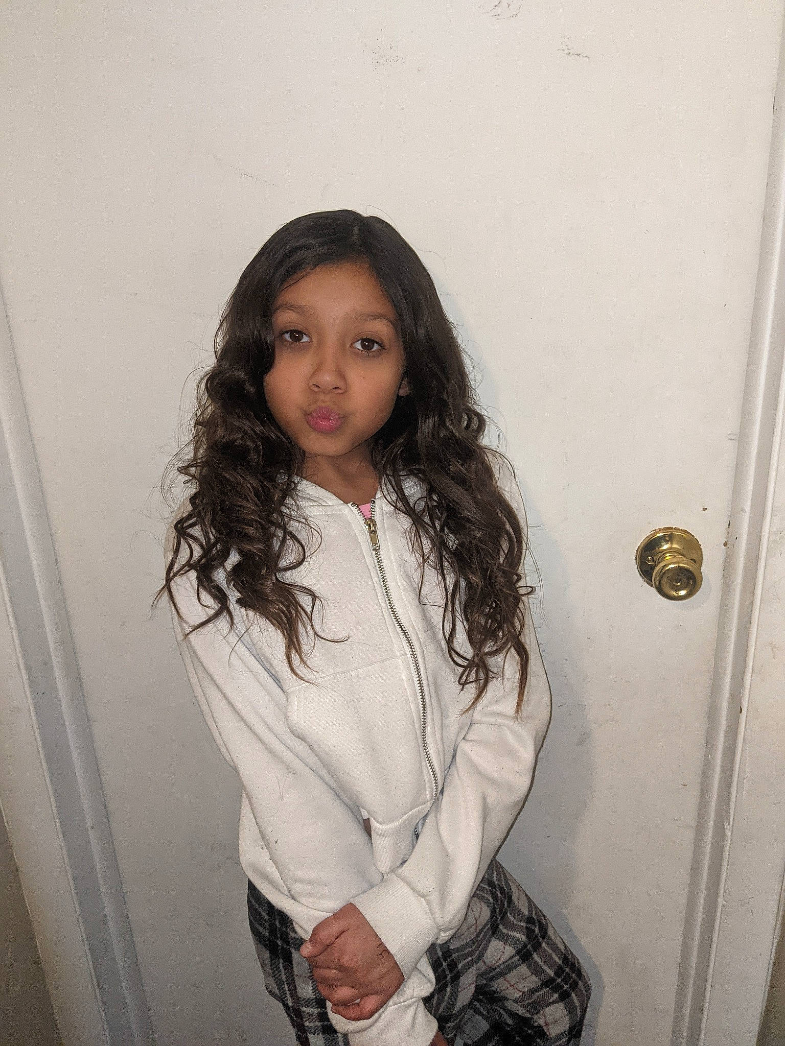 Janelle is registered to the contest to win money with this photo: black_hair, brown_hair, cool, dress_shirt, fashion_design, flash_photography, hair, hairstyle, happy, human_leg, joint, knee, layered_hair, lip, long_hair, person, shoulder, sleeve, tartan, thigh