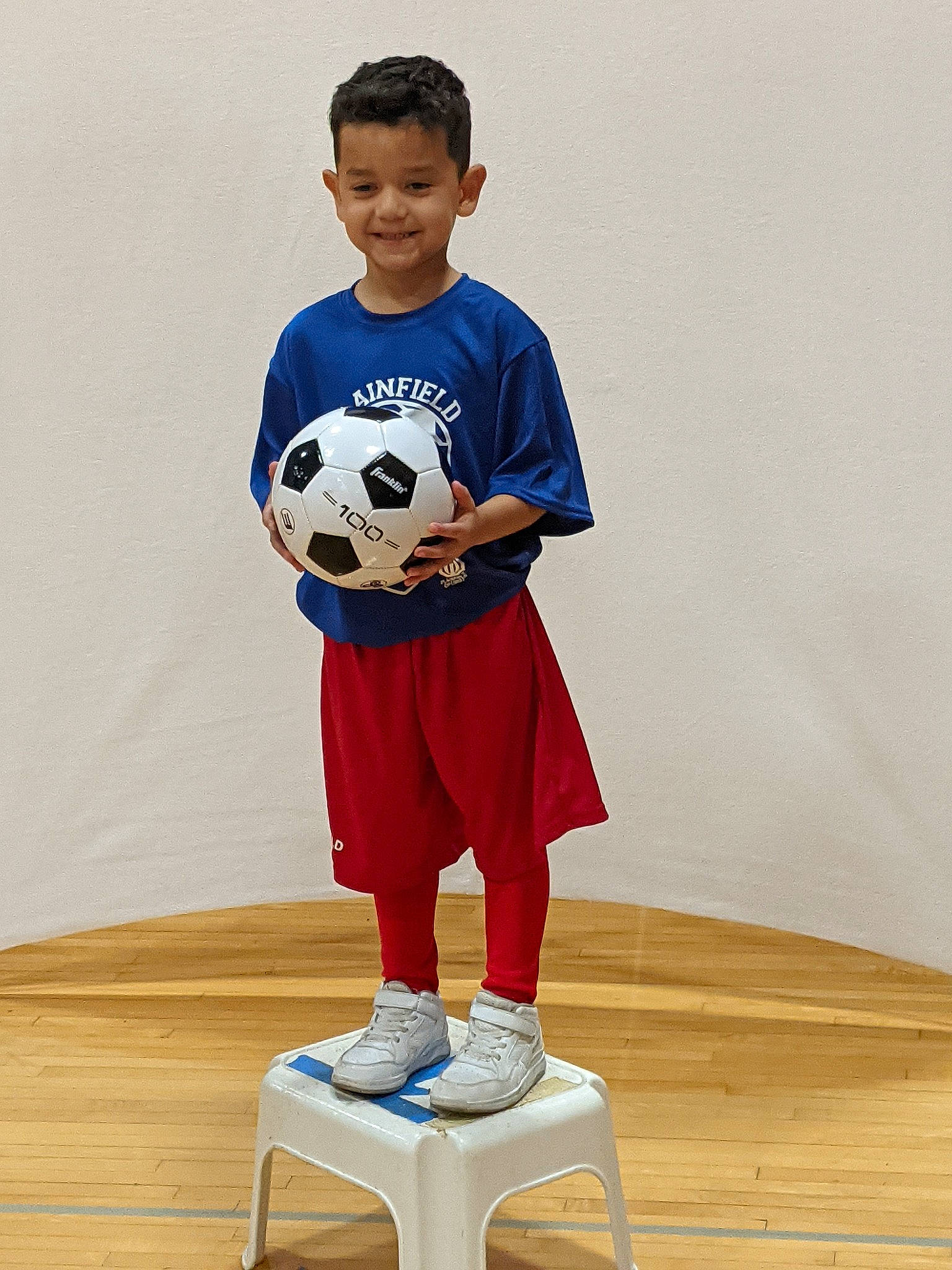 Andreas is registered to the contest to win money with this photo: ball, electric_blue, football, football_equipment, helmet, joy, knee, person, player, shirt, shorts, sleeve, smile, soccer, soccer_ball, sports, sports_equipment, sports_jersey, sportswear, street_football