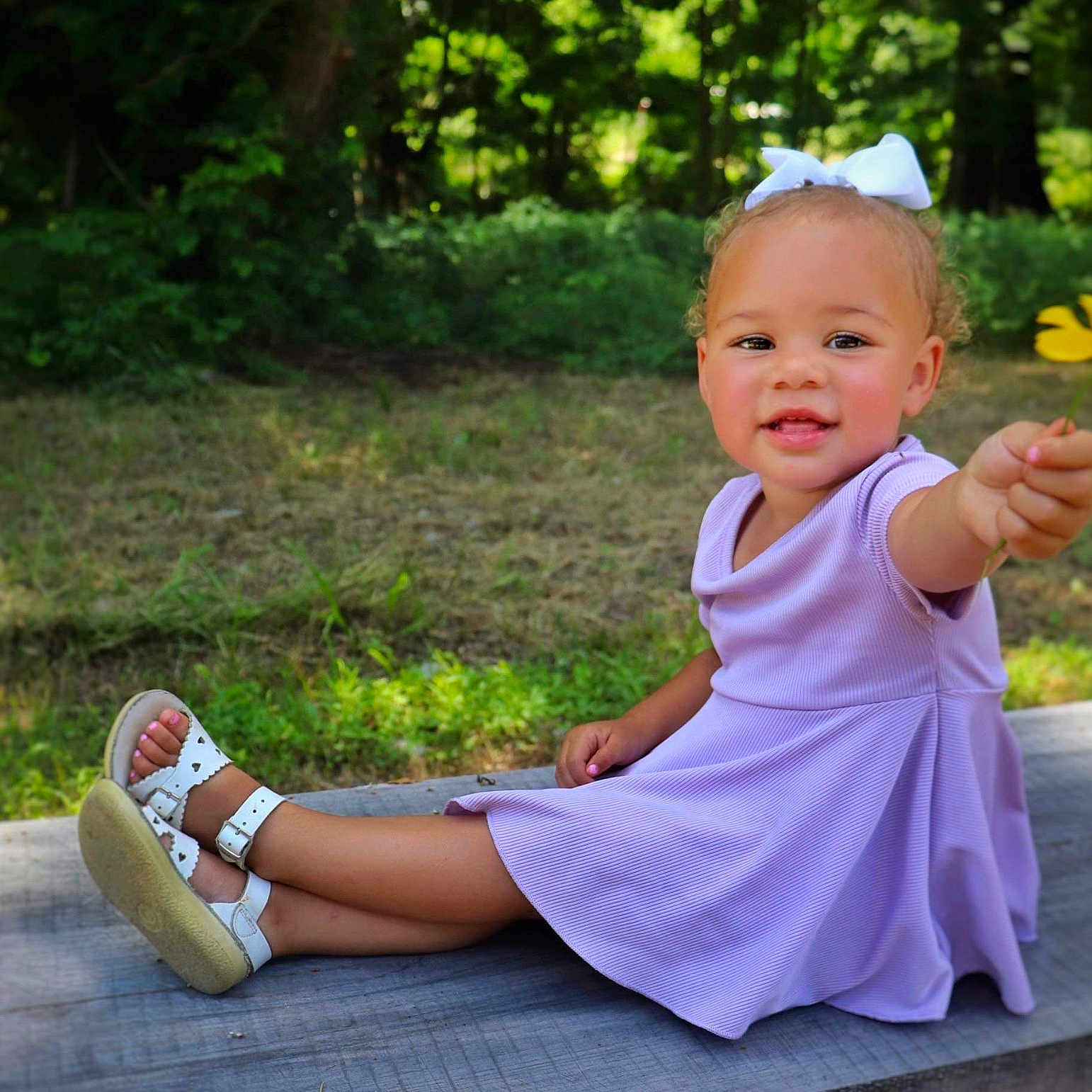 Zylah joined the competition — help win amazing prizes! clothing, dress, face, flower, footwear, grass, head, nature, outdoors, park, person, petal, photography, plant, portrait, sandal, shoe, sitting, tree, vegetation
