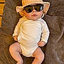 Alessio participe au concours pour gagner de l'argent avec cette photo : baby, infant, towel, hat, bucket_hat, sunglasses, clothing, cute, skin, face, person, child, relaxing, indoors, legs, arms, casual, headwear, fashion, accessory