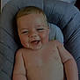 baby, laughing, smiling, infant, child, cushion, seat, indoor, skin, face, happy, chubby, arm, torso, comfortable, cute, person, young, head, expression