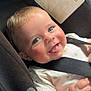 Alessio participe au concours pour gagner de l'argent avec cette photo : baby, child, car_seat, blue_eyes, smiling, tongue_out, rosy_cheeks, safety_strap, infant, cute, happy, clothing, seatbelt, close_up, person, young_child, indoor, portrait, playful, baby_girl