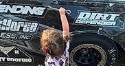 Blakelyn is registered to the contest to win money with this photo: alloywheel, car, carwheel, child, clothing, face, female, footwear, girl, head, machine, person, photography, shoe, shorts, spoke, tire, transportation, vehicle, wheel