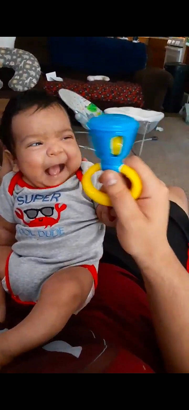 Ambrose joined the competition — help win amazing prizes! baby, baby_playing_with_toys, baby_products, baby_toddler_clothing, cheek, child, drinkware, electric_blue, finger, fun, happy, iris, person, plastic, room, sitting, smile, t_shirt, thumb, toddler