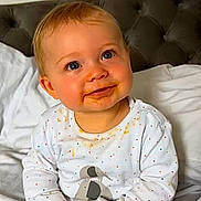 Noah Thomas joined the competition — help win amazing prizes! baby, child, blue_eyes, smiling, onesie, polka_dots, elephant_print, messy_face, bed, pillow, tufted_headboard, white_bedding, cute, infant, young_child, portrait, indoors, happy, sitting, toddler