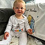 Noah Thomas joined the competition — help win amazing prizes! baby, child, smiling, pajamas, polka_dot, blanket, couch, indoor, face, person, cozy, cute, infant, soft, winnie_the_pooh, stuffed_animal_design, home, comfort, portrait, sitting