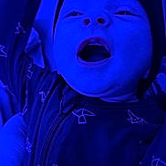 Reign joined the competition — help win amazing prizes! baby, infant, child, face, open_mouth, smile, beanie, hat, onesie, zipper, hand, close_up, blue_light, low_light, pattern, fabric, cheek, portrait, nursery, expression