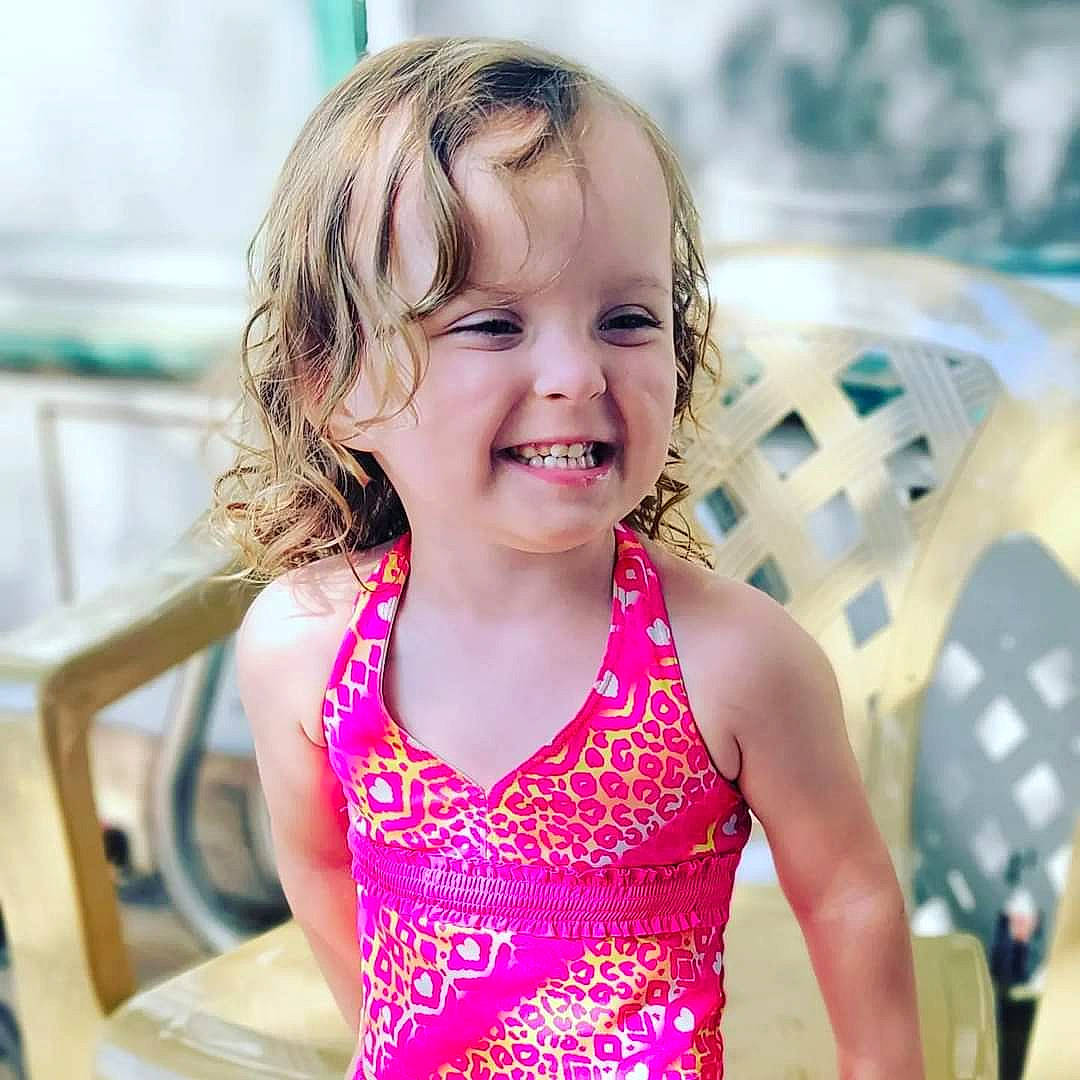 Adaline joined the competition — help win amazing prizes! blond, chair, child, event, eye, fun, happy, head, joy, laugh, leisure, magenta, neck, person, recreation, sitting, smile, summer, swimwear, t_shirt