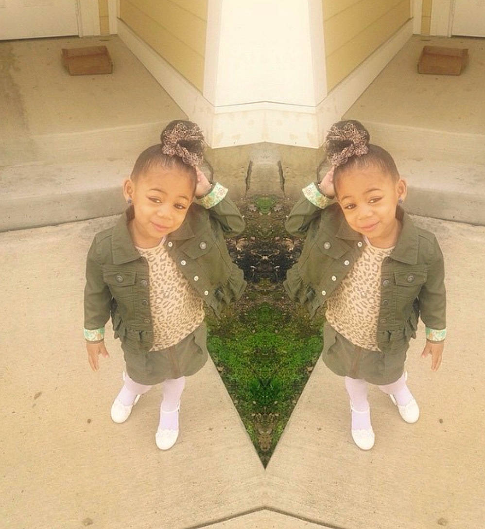 Lindsay is registered to the contest to win money with this photo: child, family, footwear, head, leg, outerwear, people, person, plant, shoe, smile, standing, toddler, vacation