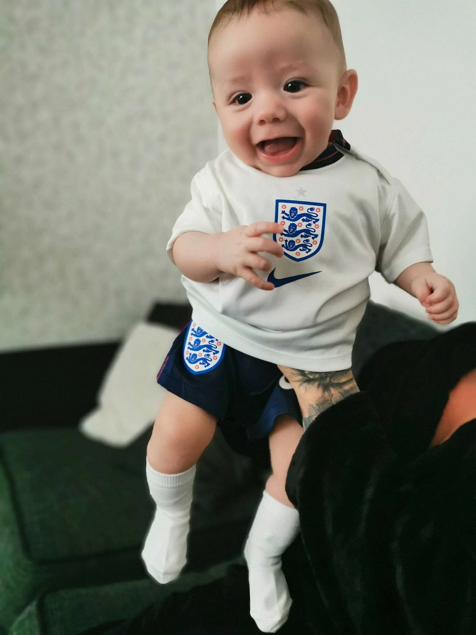 Jaxson is registered to the contest to win money with this photo: ankle, baby, baby_products, baby_toddler_clothing, cheek, child, elbow, finger, human_leg, knee, mammal, person, skin, sleeve, sock, thumb, toddler, tongue