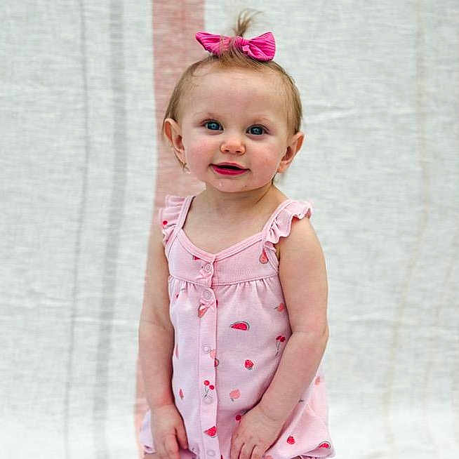 Ava'Linn is registered to the contest to win money with this photo: accessories, baby, blonde, blouse, clothing, dress, face, hair, happy, head, headband, jewelry, pants, pattern, person, photography, portrait, sitting, sleeve, smile
