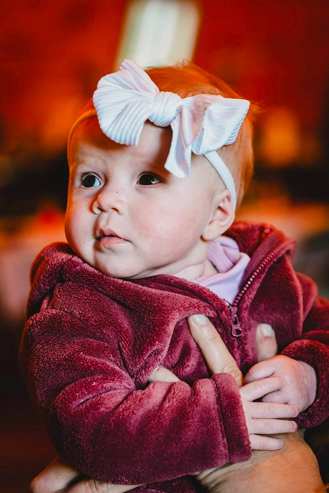 Emily is registered to the contest to win money with this photo: baby, baby_toddler_clothing, cheek, child, eye, face, flash_photography, fur, grass, happy, hat, headband, headwear, lip, peach, person, portrait, portrait_photography, sitting, skin