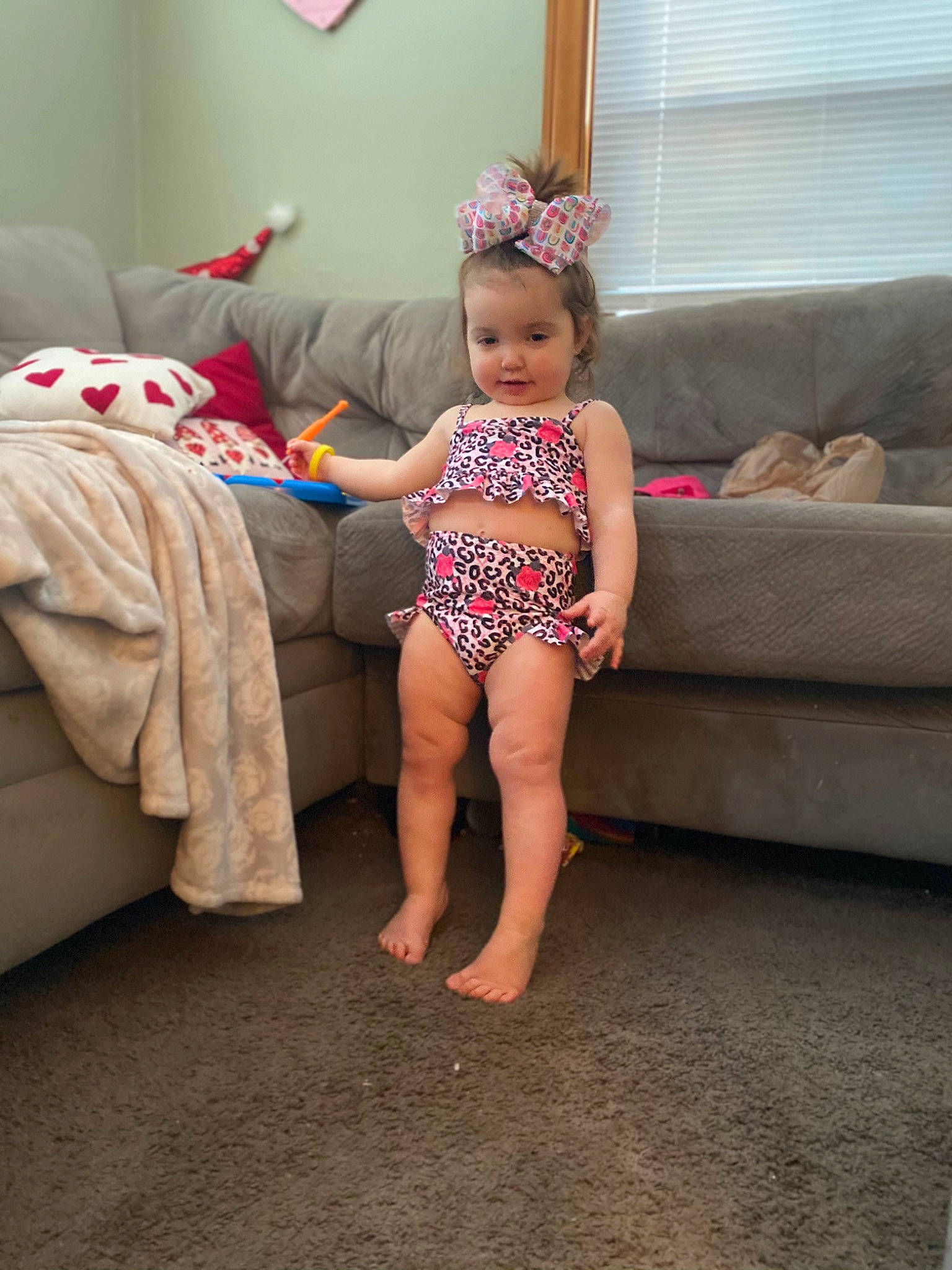 Piper joined the competition — help win amazing prizes! baby, baby_toddler_clothing, barefoot, child, comfort, couch, curtain, event, foot, happy, human_leg, knee, leg, magenta, person, pink, room, sock, textile, thigh