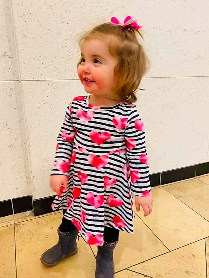 Piper joined the competition — help win amazing prizes! baby_toddler_clothing, dress, face, hair, happy, head, knee, magenta, neck, person, pink, red, shoe, sleeve, smile, standing, street_fashion, thigh, toddler, waist